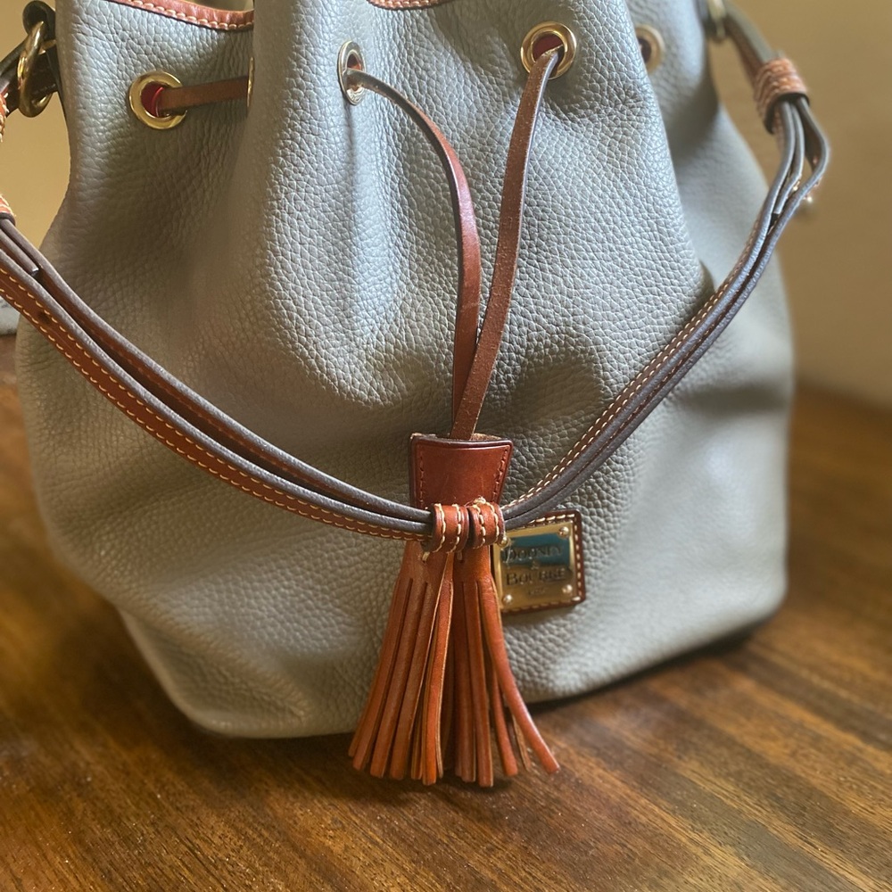 Dooney & Bourke Pebble Leather Drawstring Bag.